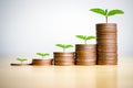 Money coin stack growing graph on wood table