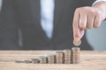 Money of coin stack step up growing growth with model white house on wooden table. Property investment and house mortgage Royalty Free Stock Photo