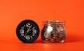 Money coins with alarm clock, Coins in glass jar on abstract background, Financial business investment, Growing money Royalty Free Stock Photo