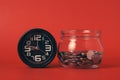 Money coins with alarm clock, Coins in glass jar on abstract background, Financial business investment, Growing money Royalty Free Stock Photo