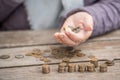 Money, coins, the grandmother on pensions and a concept of a living minimum - in hands of the old woman isn`t enough money Royalty Free Stock Photo