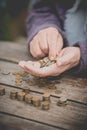 Money, coins, the grandmother on pensions and a concept of a living minimum - in hands of the old woman isn`t enough money Royalty Free Stock Photo