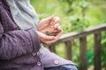 Money, coins, the grandmother on pensions and a concept of a living minimum - in hands of the old woman isn`t enough money Royalty Free Stock Photo