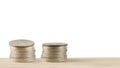 Money coins pile on table on white background. Royalty Free Stock Photo