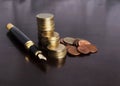 Money coins stack and Fountain Pen for Finance Concept Royalty Free Stock Photo