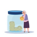 money Collection and Financial Planning concept. Happy Elderly Woman Holding Big Coin for Savings in Jar Royalty Free Stock Photo