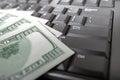 Money on computer keyboard Royalty Free Stock Photo
