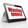 Money concept: Tablet Computer with Wasting Money on display Royalty Free Stock Photo