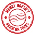 MONEY DOESN`T GROW ON TREES text on red round postal stamp sign