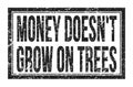 MONEY DOESN`T GROW ON TREES, words on black rectangle stamp sign