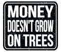 MONEY DOESN`T GROW ON TREES, words on black stamp sign