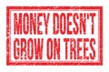 MONEY DOESN`T GROW ON TREES, words on red rectangle stamp sign