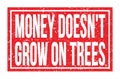 MONEY DOESN`T GROW ON TREES, words on red rectangle stamp sign