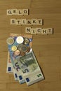 Money doesnt stink, word in german Geld stinkt nicht