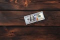 Money. Dollars on a wooden background