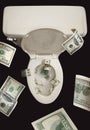 Money Down the Toilet Royalty Free Stock Photo