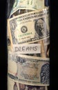 Money dreams and black background, close up