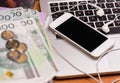 Money and electronic devices Royalty Free Stock Photo