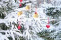 Money in euros on a Christmas tree with heart decorations, concept. New Year in a winter forest with snowy trees Royalty Free Stock Photo