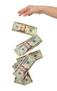 Money falling from an open hand isolated on white Royalty Free Stock Photo
