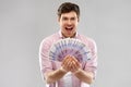 Happy young man with fan of euro money Royalty Free Stock Photo