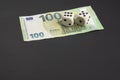 100 EUR banknote at top of frame on black background with copy space. Royalty Free Stock Photo