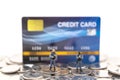 Money, Financial, Payment, Business and Security concept. Police or soldier miniature figures with gun standing on pile of coin