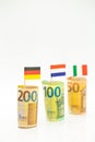 Money and flags of European countries.Flags of Germany, France and Italy euro bills on a white background.euro inflation Royalty Free Stock Photo