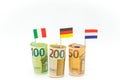 Money and flags of European countries.Flags of Germany, France and Italy euro bills on a white background.euro inflation Royalty Free Stock Photo