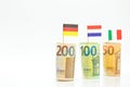 Money and flags of European countries.Flags of Germany, France and Italy euro bills on a white background.euro inflation Royalty Free Stock Photo