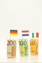 Money and flags of European countries.Flags of Germany, France and Italy euro bills on a white background.euro inflation Royalty Free Stock Photo