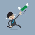 Money is flying away from businessman Royalty Free Stock Photo