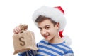 Money gift Christmas concept, santa claus holding a bag with currency Royalty Free Stock Photo