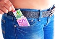 Money in Girls Jeans Front Pocket Royalty Free Stock Photo