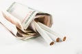 Money and group of cigarettes Royalty Free Stock Photo