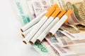 Money and group of cigarettes Royalty Free Stock Photo