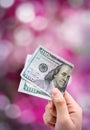 Money in hand,  on pink background Royalty Free Stock Photo