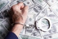 Money and handcuffs bribery of the authorities Royalty Free Stock Photo