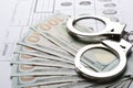 Money, handcuffs and fingerprint record sheets, closeup. Royalty Free Stock Photo