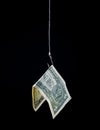 Money hanging on a fish hook Royalty Free Stock Photo