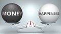 Money and happiness in balance - pictured as a scale and words Money, happiness - to symbolize desired harmony between Money and Royalty Free Stock Photo