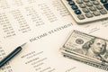 Money and income statement report in sepia tone Royalty Free Stock Photo