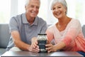 Money, investment and portrait of old couple with savings in jar for retirement, fund or future plan. Senior, finance Royalty Free Stock Photo