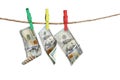 Money laundering. Dollar banknotes hanging on clothesline against white background Royalty Free Stock Photo