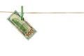 Money laundering. Dollar banknotes hanging on clothesline isolated on white background Royalty Free Stock Photo