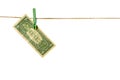 Money laundering. Dollar banknotes hanging on clothesline isolated on white background Royalty Free Stock Photo