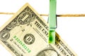 Money laundering. Dollar banknotes hanging on clothesline isolated on white background Royalty Free Stock Photo