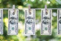 Money Laundering. Money Laundering US dollars hung out to dry. 100 dollar bills hanging on clotheslines Royalty Free Stock Photo