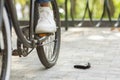 Money Lost. Unrecognizable Black Man Dropped His Wallet While Riding Bicycle Royalty Free Stock Photo