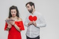 Money and love. Dollar hands. A man holds a red heart in his arms a wife holds the money. Valentine`s Day Royalty Free Stock Photo